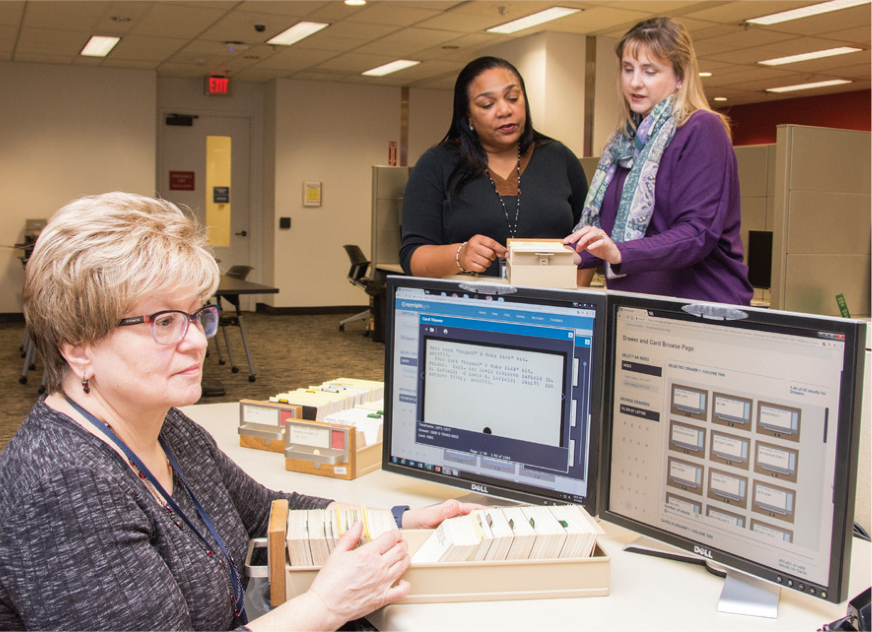 Person at computer using card catalog