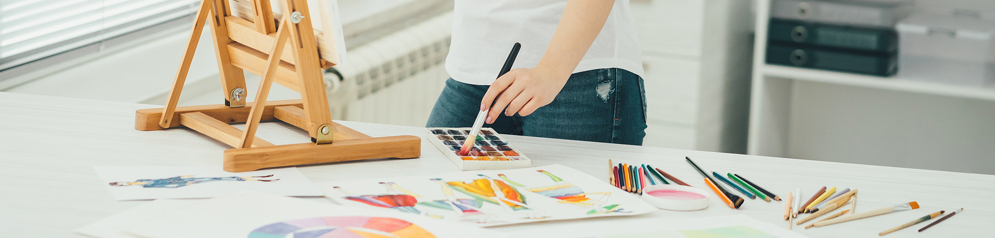 Artist using paint supplies