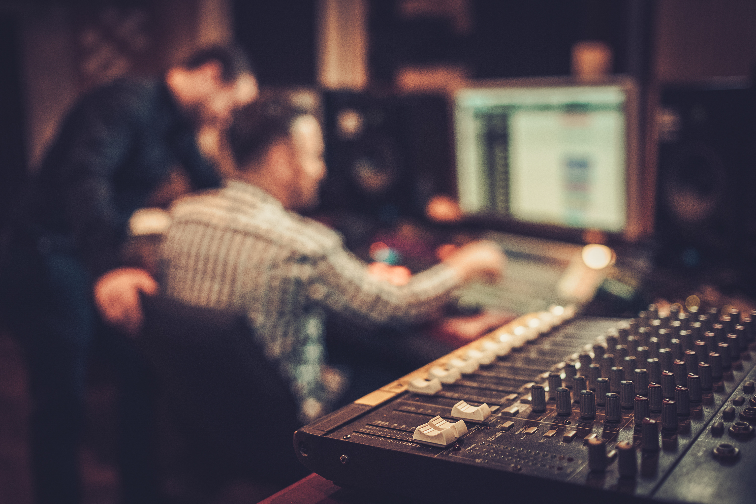 Musicians at computer; sound board